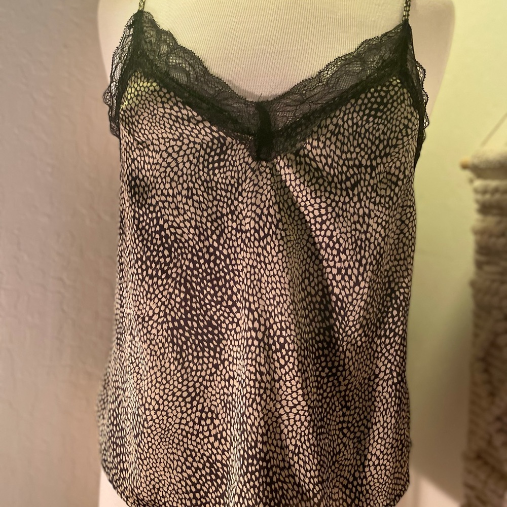 ‘Renamed’ party top!!  Pretty design and soft fabric. Very flattering.